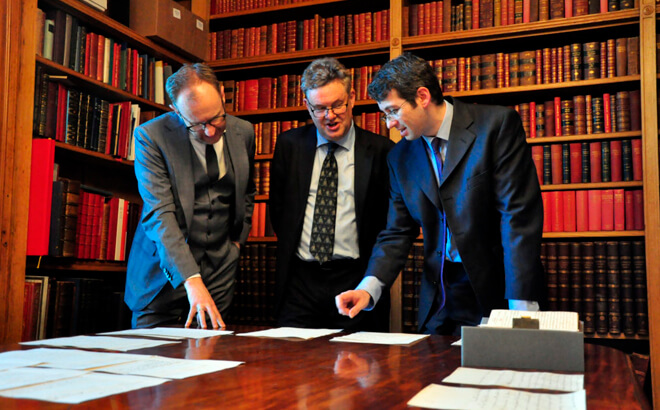 People looking at Manuscript